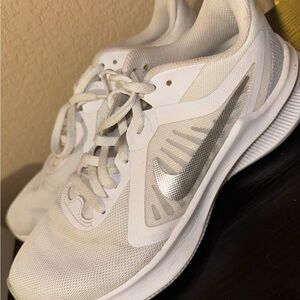 Nike Women's White Athletic Sneakers with Silver Swoosh Accent